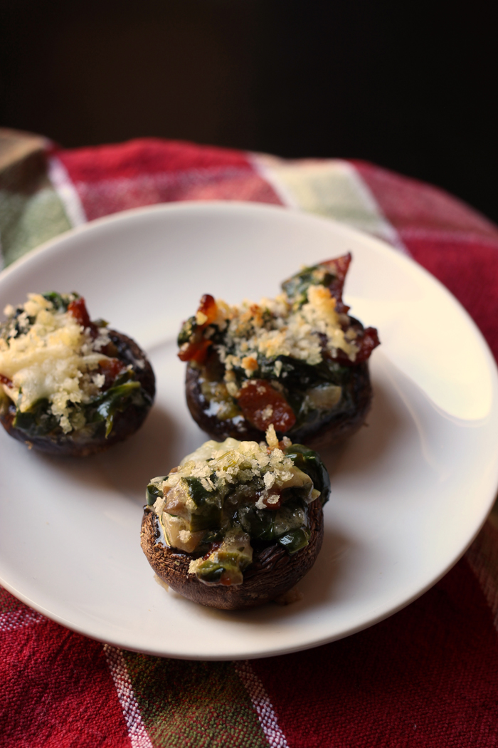 stuffed mushrooms on small white plate