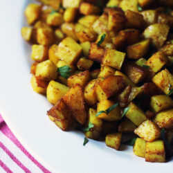 close up of curried potatoes on platter