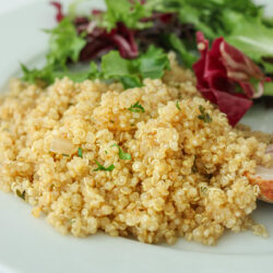 closeup of quinoa pilaf on dinner plate.