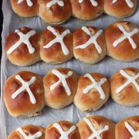 A close up of Hot cross buns on tray