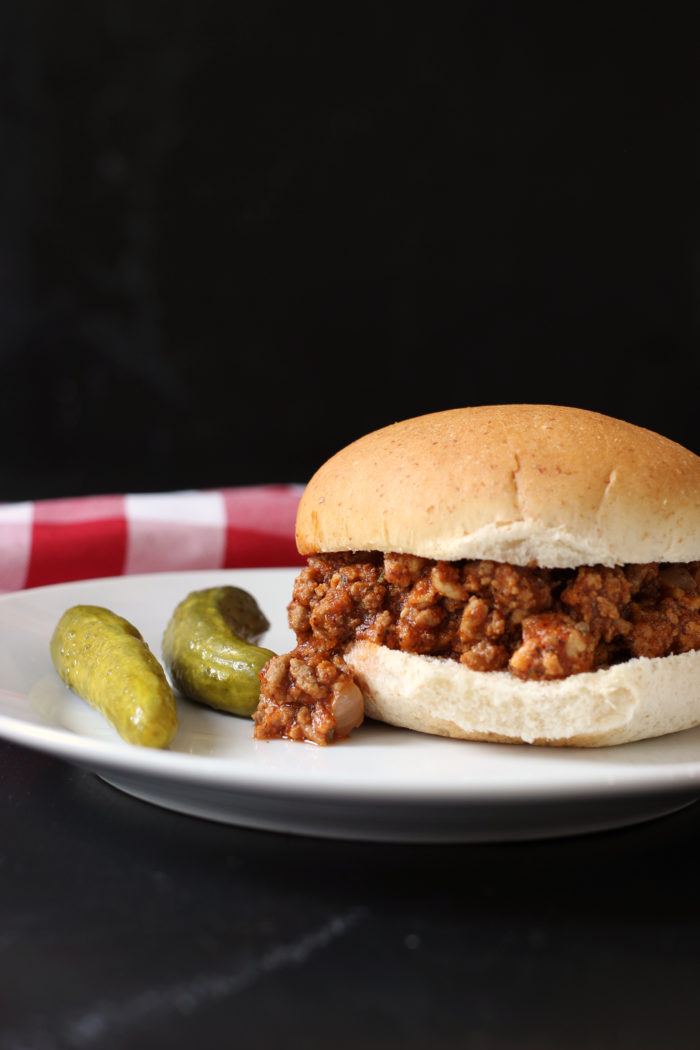 A close up of a sloppy joe on a plate