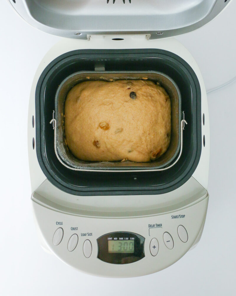 the risen dough in bread maker pan.