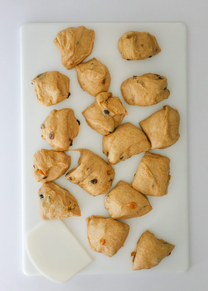 dough on cutting board in pieces.