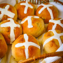 array of hot cross buns in basket.