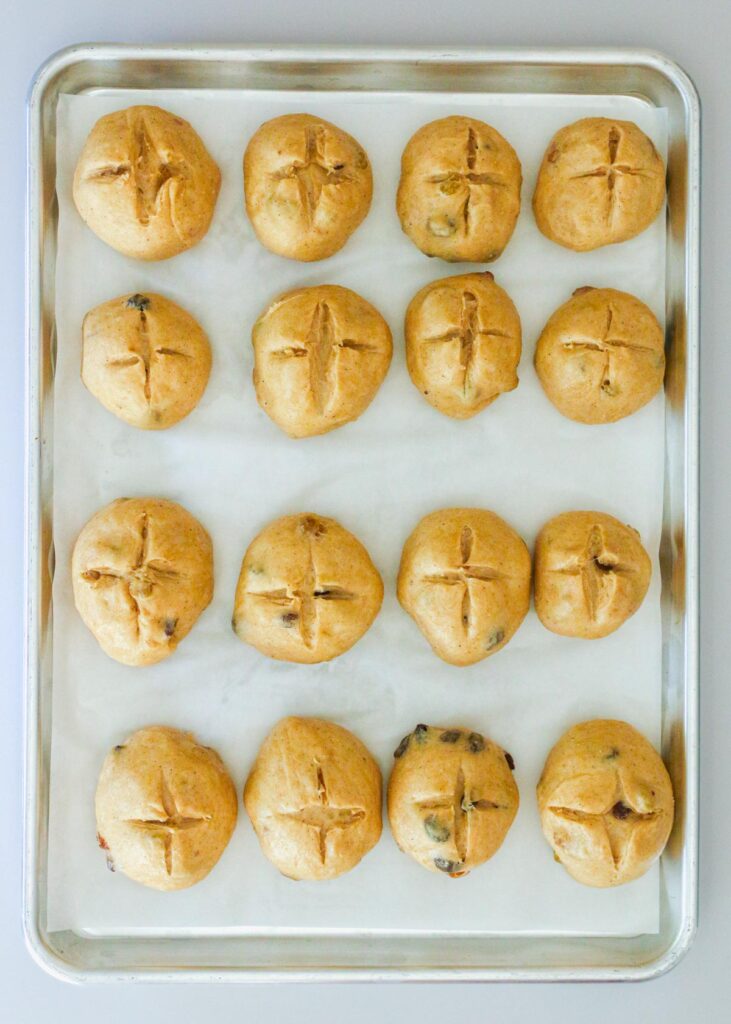 rolls on parchment lined pan ready to bake.