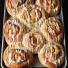 pan of baked and glazed rainbow rolls