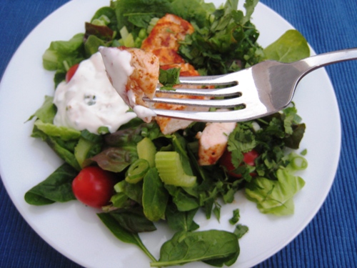 A plate of salad with fork