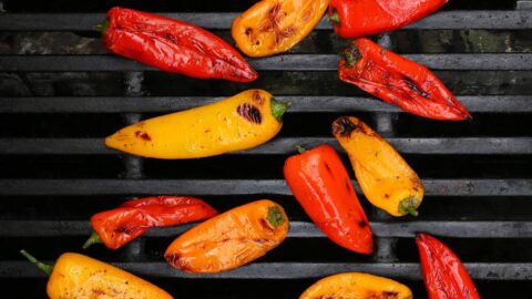 charred peppers on a grill.