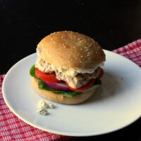 turkey burger on plate with blue cheese crumbles