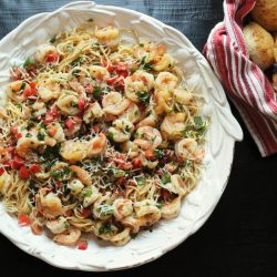 A bowl of cilantro shrimp pasta