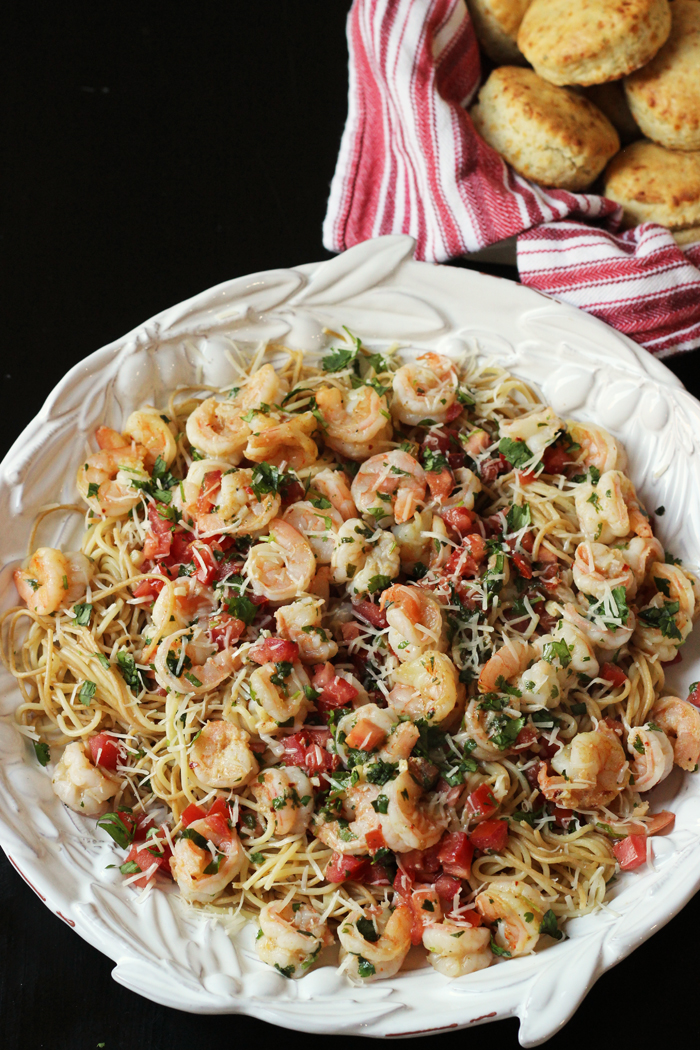 A dish is filled with pasta and shrimp