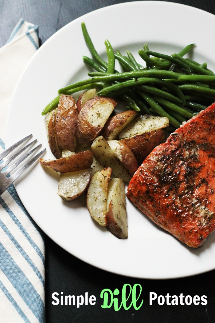 Simple Dill Potatoes on plate with salmon and green beans
