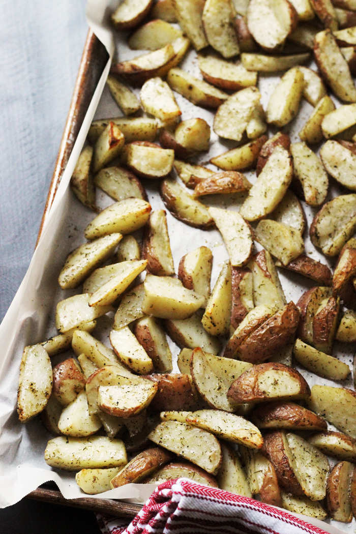 Potato wedges on baking sheet