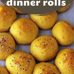 baked rolls with everything seasonings on parchment with text overlay.