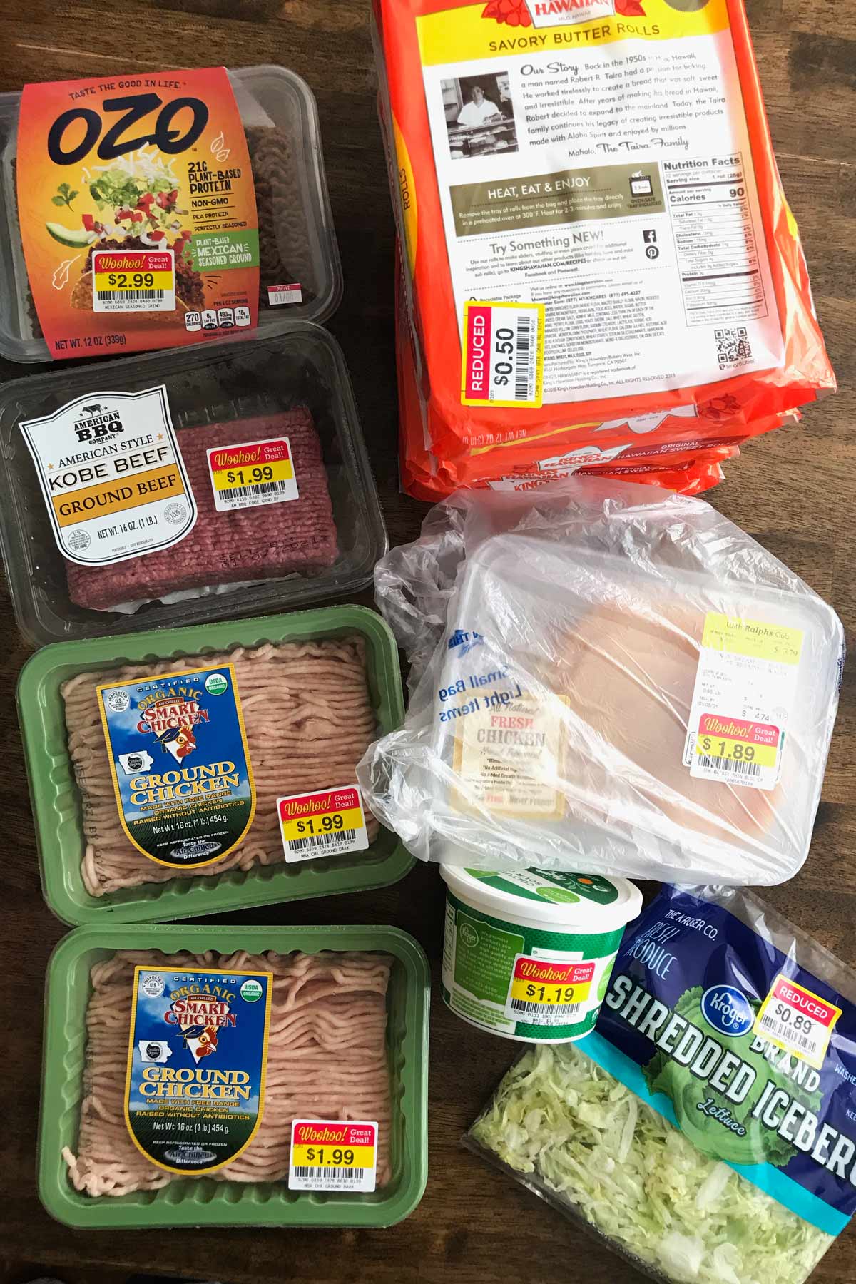 array of meats, dairy, bread, and produce christmas clearance laid out on table.