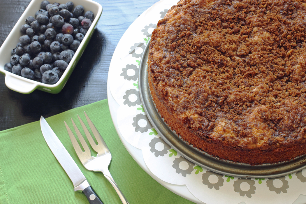 A plate with blueberries and Cinnamon Streusel Coffeecake