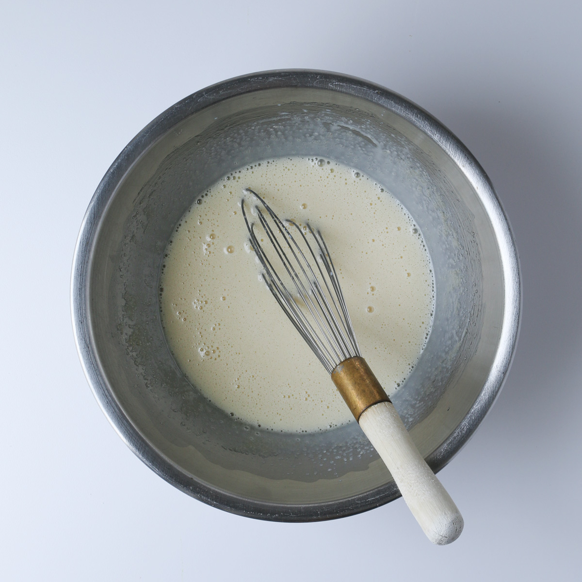 the wet ingredients combined in a mixing bowl, with the whisk.