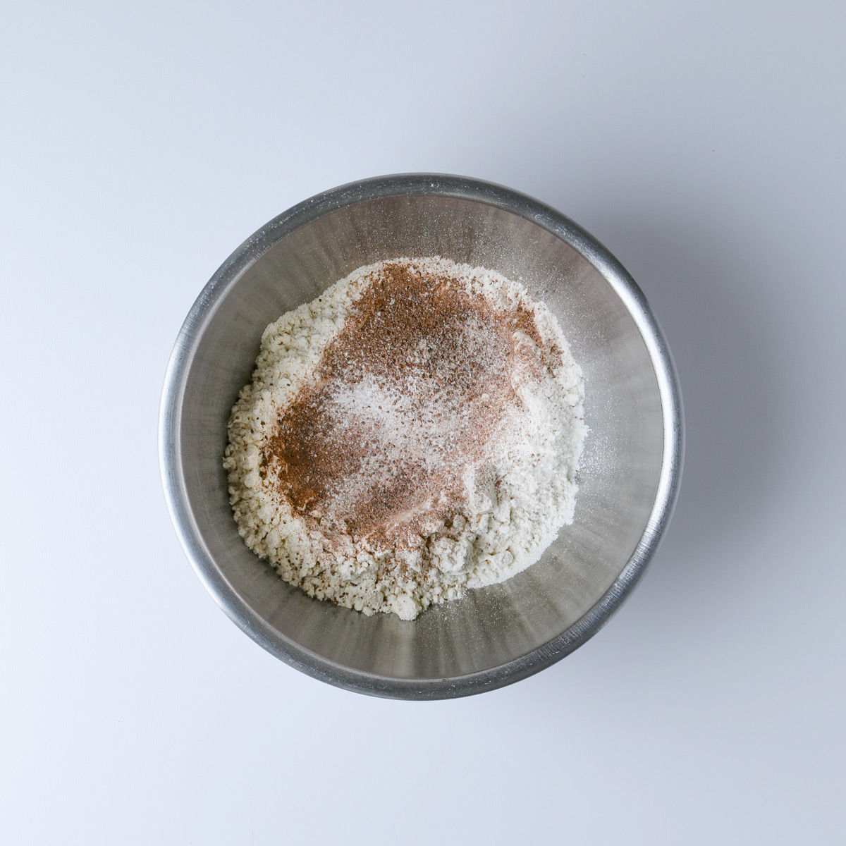 dry ingredients added to a mixing bowl.
