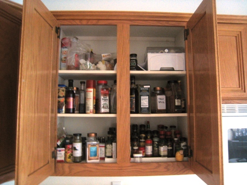 cluttered spice cupboard