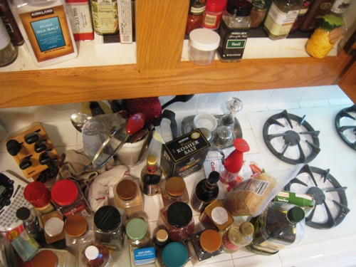 emptying spice cupboard on counter