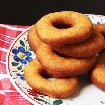 buttermilk donuts stacked on a plate