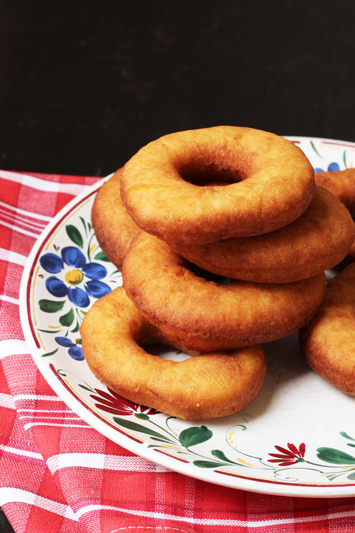 buttermilk donuts stacked on a plate