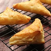 apple turnovers on a rack cooling