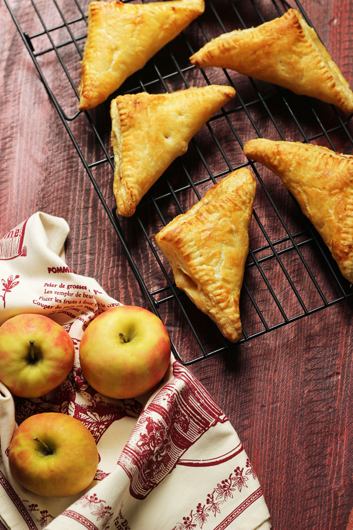rack of apple turnovers with apples