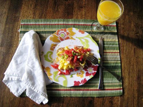 loaded breakfast potato on a plate on breakfast table