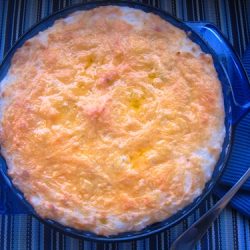 cheddar and leek potato bake in blue pie plate