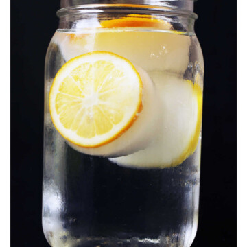 A glass of water with lemon cubes