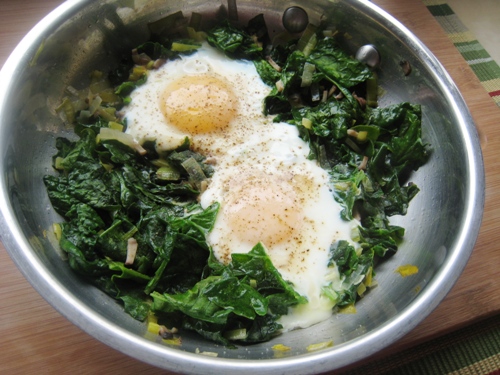 close up of Eggs and Spinach in a skillet