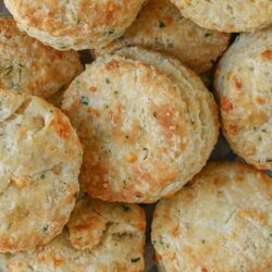 stacks of golden brown cheddar biscuits.