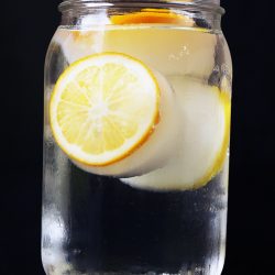 jar of water with lemon ice cubes