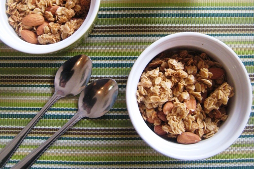 bowls of granola with spoons