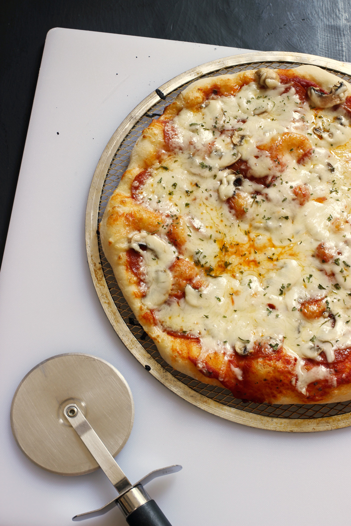 grilled pizza on cutting board