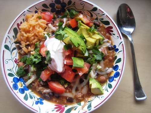 A plate of food on a table, with turkey Leftovers