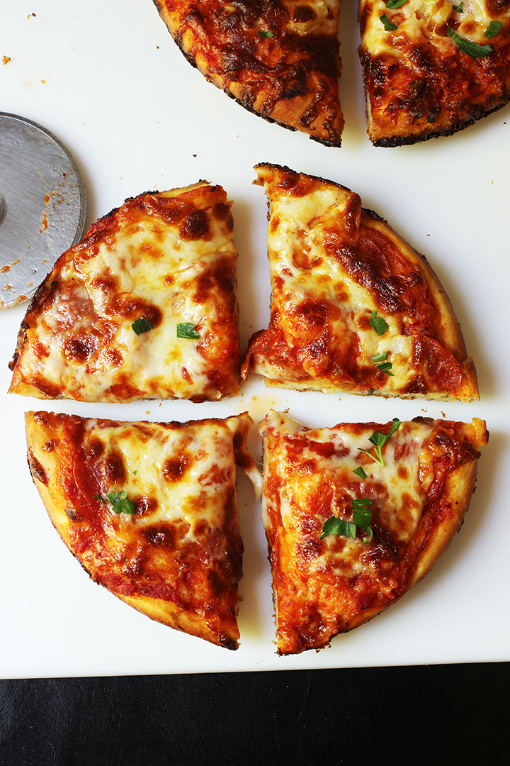 deep dish pineapple pizza cut into quarters