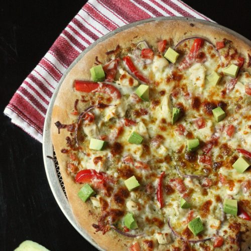 pizza topped with fresh avocado