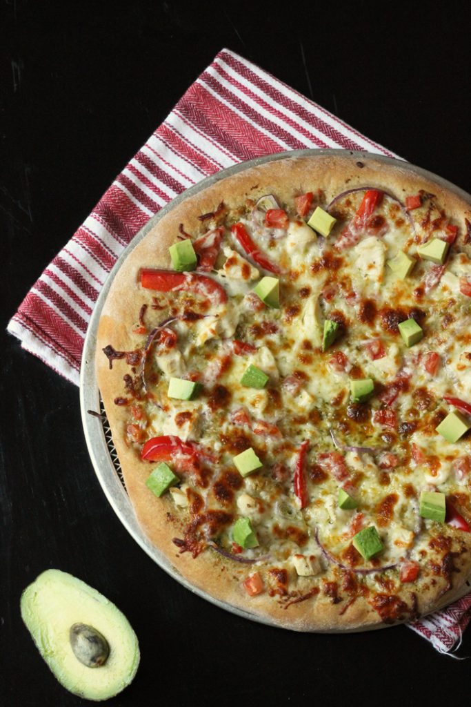 pizza topped with fresh avocado