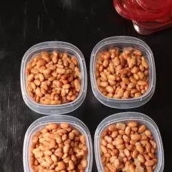 cooked pinto beans divided into containers for freezing