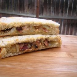 Bacon and Brie Panini on cutting board