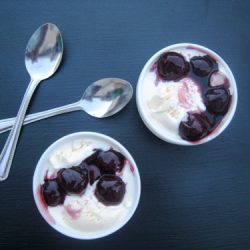 bowls of cherries jubilee with spoons