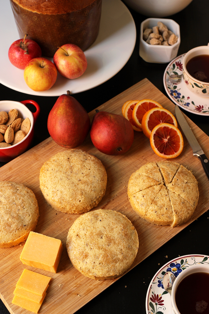 tables set with cakes cheese fruit nuts and tea