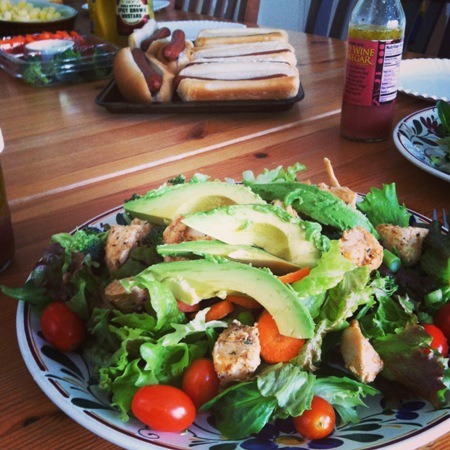 Lunch table with hot dogs and salad