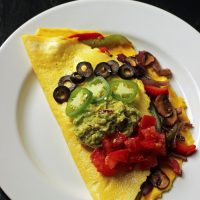 Fajita omelet on a plate on a table