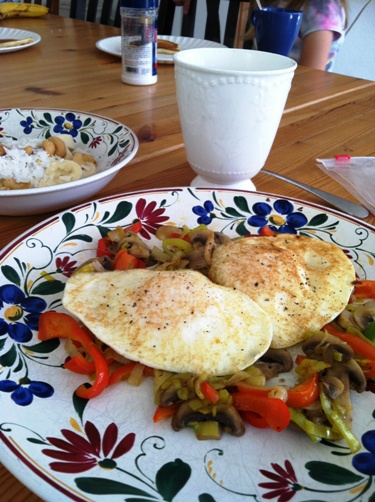 A plate of eggs and vegetables on a table