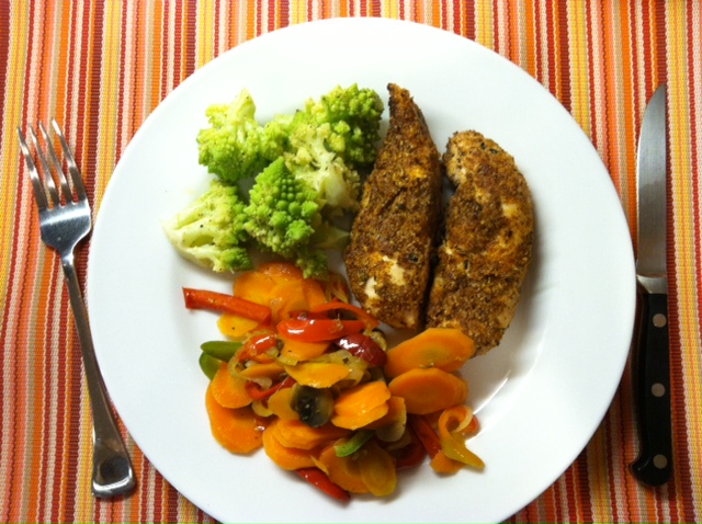 A plate full of chicken and veg