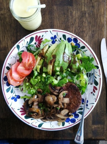 A plate of food on a table, with Salad