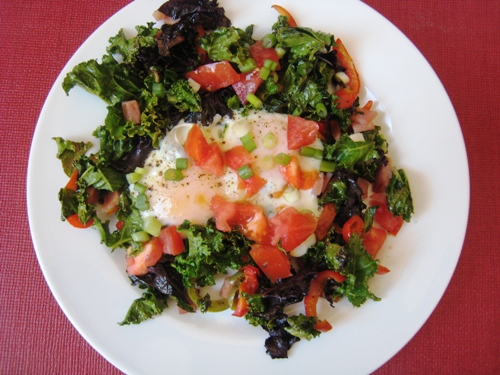 A plate of food with Eggs and greens